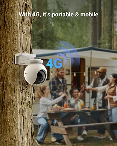 Outdoor 4G security camera mounted on a tree near a picnic area.