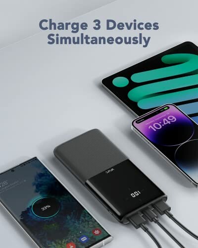 Power bank charging three devices simultaneously.