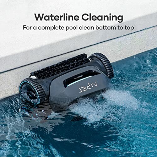 Pool cleaning robot at waterline of a swimming pool.