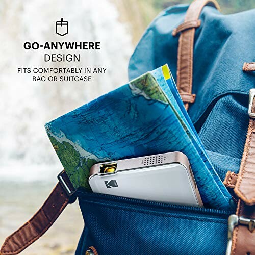 Portable printer and map in blue backpack pocket outdoors.