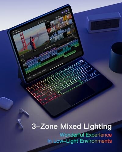 Tablet with RGB keyboard displaying video editing software.