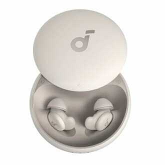 Wireless earbuds in a round charging case.